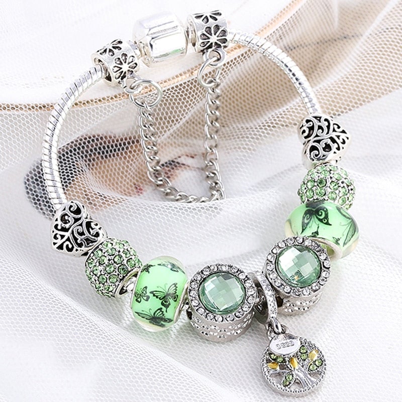 Elegantes Armband aus Sterling Silber mit funkelndem grünem Kristall