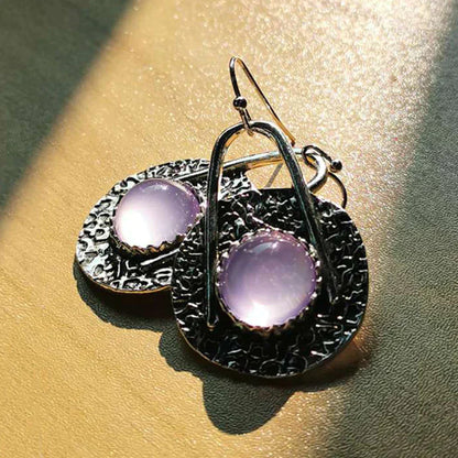 Elegante Boho-Ohrringe mit leuchtenden lilafarbenen Steinen aus Sterlingsilber