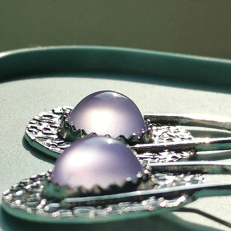 Elegante Boho-Ohrringe mit leuchtenden lilafarbenen Steinen aus Sterlingsilber