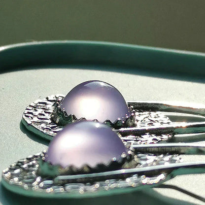 Elegante Boho-Ohrringe mit leuchtenden lilafarbenen Steinen aus Sterlingsilber