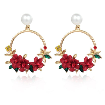 Elegante goldene Ohrringe mit Blumen- und Perlendesign