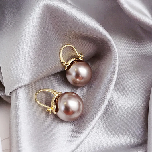 Elegante Bronze-Ohrringe mit funkelnden Perlen