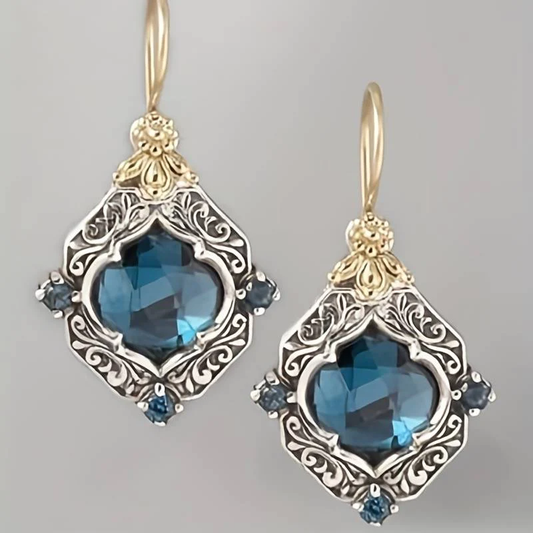 Elegante blaue Kristallohrringe mit Gold- und Silberakzenten